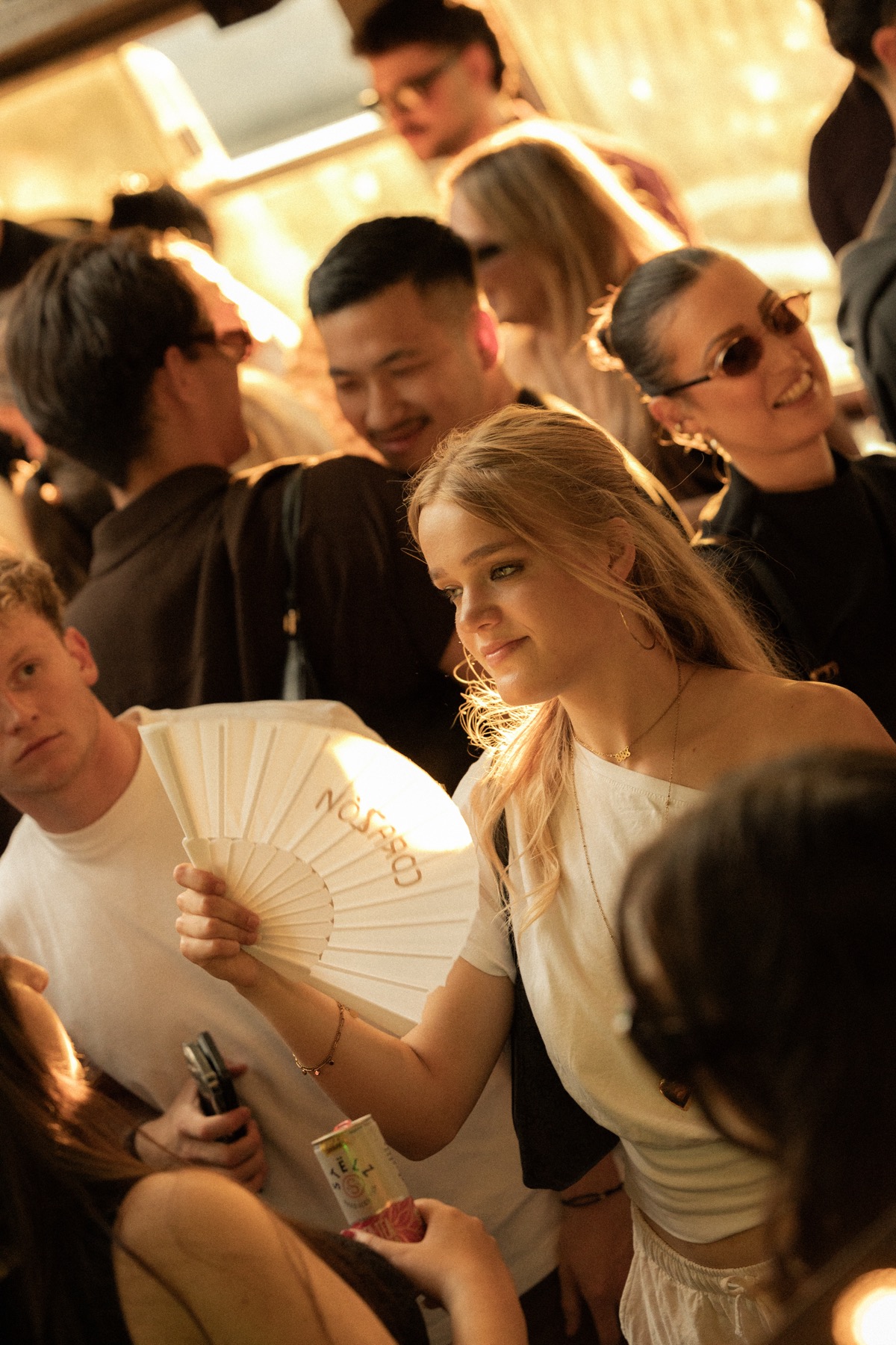 A guest sharing a candid moment among the Sunset Cruise crowd